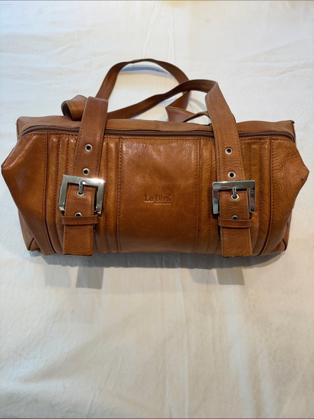 La Diva Tan Leather Crossbody Barrel Bag with Buckle Detail